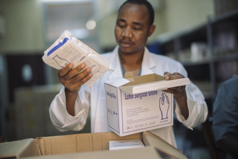 Pharmacist Jonas Kamaté in Mali unloads infection-prevention supplies.