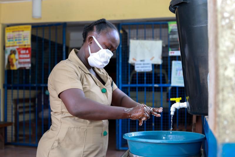 Community Health Nurse Olivia Yeboah thoroughly washes her hands at the Akropong Clinic in Ghana. Photo by Emmanuel Attramah, PMI Impact Malaria / U.S. President's Malaria Initiative.